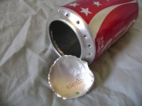 Cut out the bottom of the can Cut out the bottom of the can