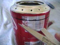 Rough cut to separate top of stove from the rest of the can Rough cut