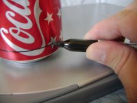 Creating a line around the stove with a Sharpie at the correct measurement