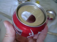 Remove the tab used to open the soda can and the tab formed when the soda can was opened