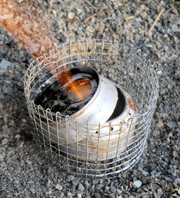 The simmer ring sits crooked on the soda can stove. This is normal and can easily be fixed.