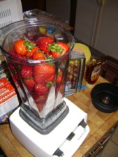 Add fruit and honey to blender